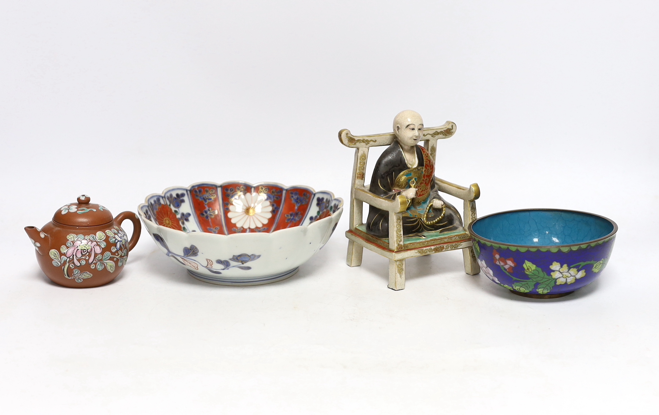 A Chinese enamelled yixing teapot and cloisonné bowl together with a Japanese Imari bowl and a Satsuma seated figure of a Buddhist monk, tallest 14cm